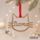 imagen principal con fondo navideño de bola navideña en tablex para mascotas con silueta con forma de cara de gato personalizada con el nombre por dentro de la silueta y cinta roja para colgar del árbol de navidad.
